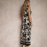 Damejumpsuit – Ærmeløs – V-hals – Bindebånd i taljen – Flagrende printet snit