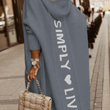 Lang damefrakke – Afslappet pasform – Strikket uld – Hætte – Grafisk ryg