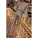 Damesæt i to dele – Cropped top med høj hals og pufærmer – Bukser med høj talje og svajer – Skinnende pailletter