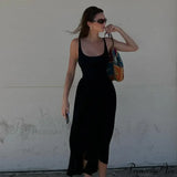 Ærmeløs trapez-midikjole med rund hals, A-snit, ideel til sommer, afslappede strandfester eller clubbing.