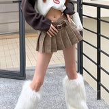 Højtaljet plisseret nederdel med houndstooth-mønster