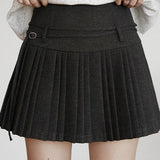 Højtaljet plisseret nederdel i ensfarvet uld