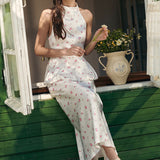 Todelt sæt: vest og maxinederdel med satinprint og pufkant