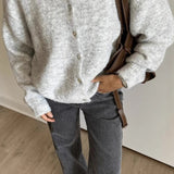 Vintage lysegrå strikvest med muslingeknapper