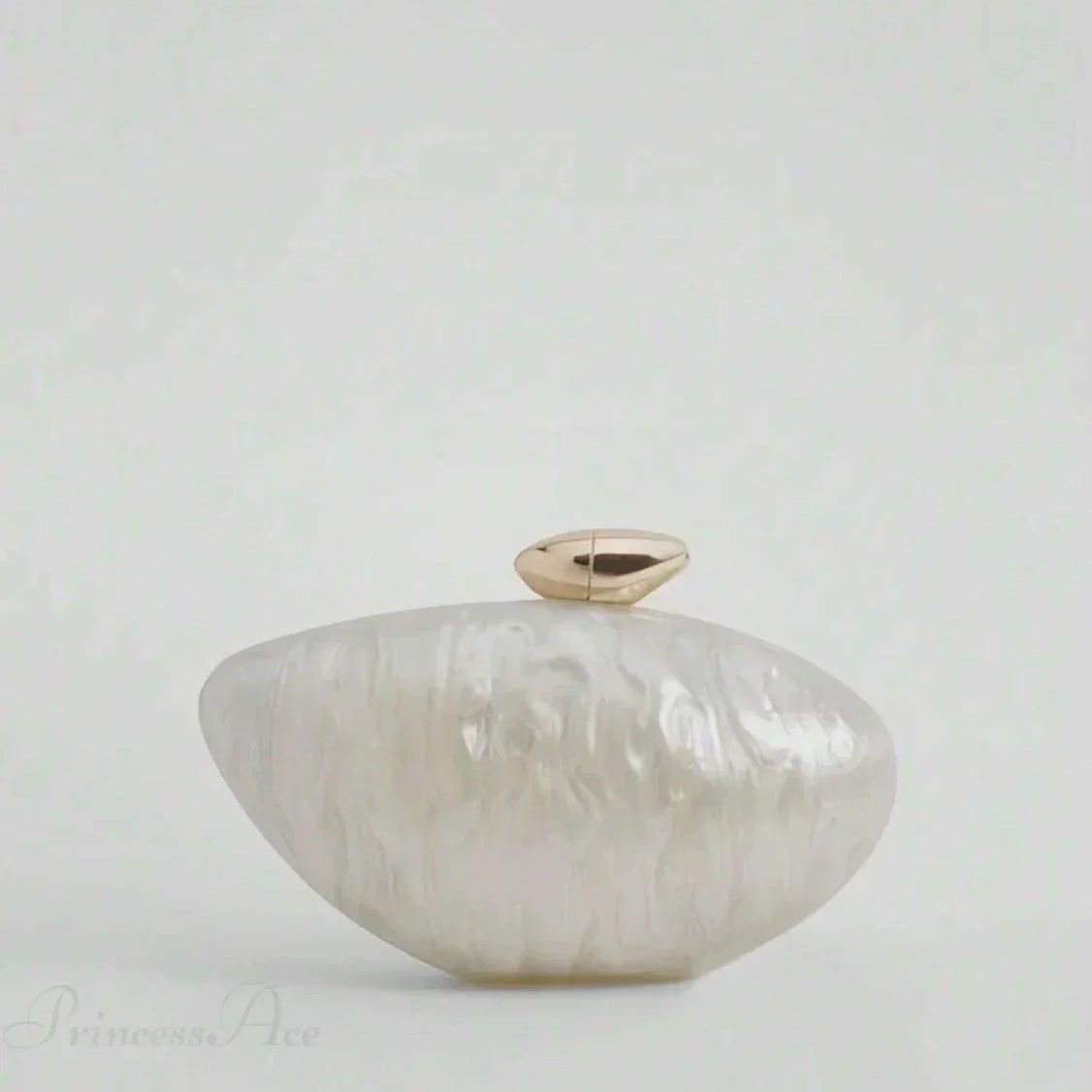 Æggeformet aftenhåndtaske i akryl i designerstil med en pung i perlemor.