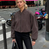 Retro grå ruskindspilotjakke med opretstående krave og lynlåslukning