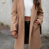 Lang, ensfarvet frakke i uldblanding