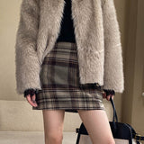 Højtaljet nederdel med farveblok og ternet mønster