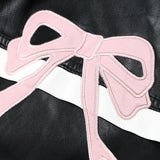 Bikerjakke i imiteret læder med dekorativ sløjfe