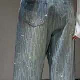 Brede, falmede jeans helt udsmykket med rhinsten