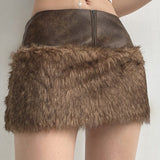 Lavtaljet mini-nederdel med bløde læderpaneler