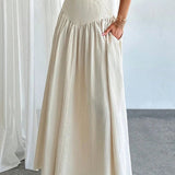 Elegant trapeznederdel med høj talje og flæser, bælte og sidelommer