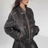 Bikerjakke i imiteret læder med dekorativ sløjfe