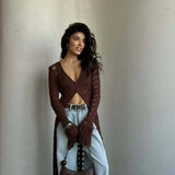 Langærmet strandvest med svaj i strik