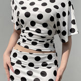 Todelt sæt med top med polkaprikker og flagermusærmer