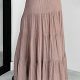 Lang, højtaljet A-formet nederdel med kontrasterende snøre, boheme-chic stil