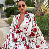 Kort kjole med lanterneærmer og et frisk blomsterprint