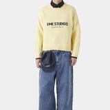 Løstsiddende broderet strikbluse