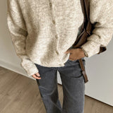 Vintage lysegrå strikvest med muslingeknapper