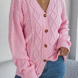 Løstsiddende, langærmet, enkeltradet strikcardigan