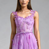 Aftenkjole med spaghettistropper og sommerfuglemotiv