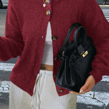 Minimalistisk cardigan med lange ærmer og knapper