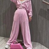 Todelt sæt: lyserøde strikkede bukser med lige ben og lynlås til kontoret