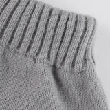 Kabelstrikket nederdel med pomponer