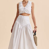 Elegant hvid maxinederdel med høj talje og patchwork-knapper