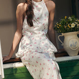 Todelt sæt: vest og maxinederdel med satinprint og pufkant