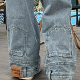 Jeans med brede ben og indadvendte lommer