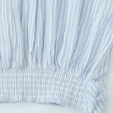 Sæt med stribet langærmet skjorte og højtaljet miniskørt med bindebånd foran