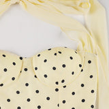 Tulipan minikjole med åben ryg og polkaprikket bælte