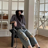 Vide, revnede og løstsiddende Capri-jeans