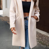 Lang, ensfarvet frakke i uldblanding