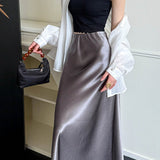 Højtaljet, draperet nederdel med fiskehalekant