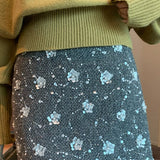 Kort, højtaljet A-formet nederdel med pailletter