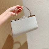 Klassisk plisseret og glitrende aftenhåndtaske