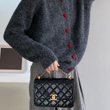 Oversized cardigan med hjerteformede knapper og rund hals