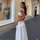 Strandnederdel og bikini-sarongsæt med udskåret talje