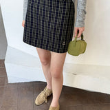 Højtaljet trapeznederdel med vintage-ternet mønster