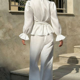 Vintage todelt sæt bestående af en top med klokkeærmer og bukser med vide ben