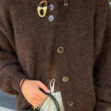 Minimalistisk cardigan med lange ærmer og knapper