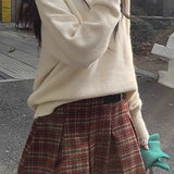 Ternet plisseret nederdel i uld