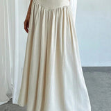 Elegant trapeznederdel med høj talje og flæser, bælte og sidelommer