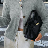 Minimalistisk cardigan med lange ærmer og knapper