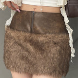 Lavtaljet mini-nederdel med bløde læderpaneler