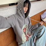Oversized hættetrøje med grafisk perleprint i trendy streetwear-stil