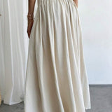 Elegant trapeznederdel med høj talje og flæser, bælte og sidelommer