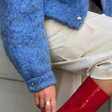 Blå uldjakke med lange ærmer